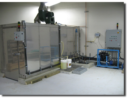 Pioneer Industries cubicle style sanitizing cart wash system.